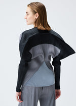 A model wears the PLEATS PLEASE ISSEY MIYAKE SQUARE tunic.