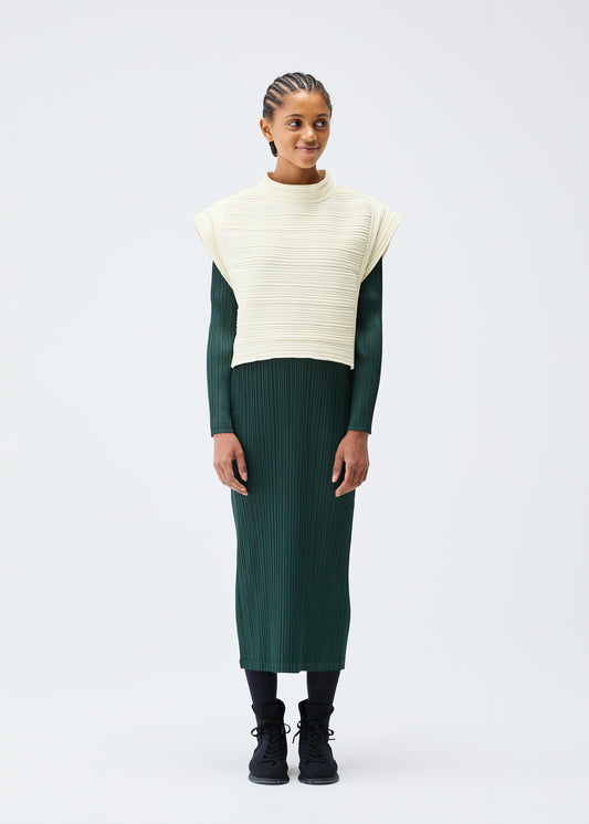A model wears the PLEATS PLEASE ISSEY MIYAKE CREPE KNIT clothing.