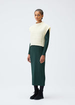 A model wears the PLEATS PLEASE ISSEY MIYAKE CREPE KNIT clothing.