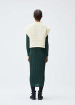 A model wears the PLEATS PLEASE ISSEY MIYAKE CREPE KNIT clothing.