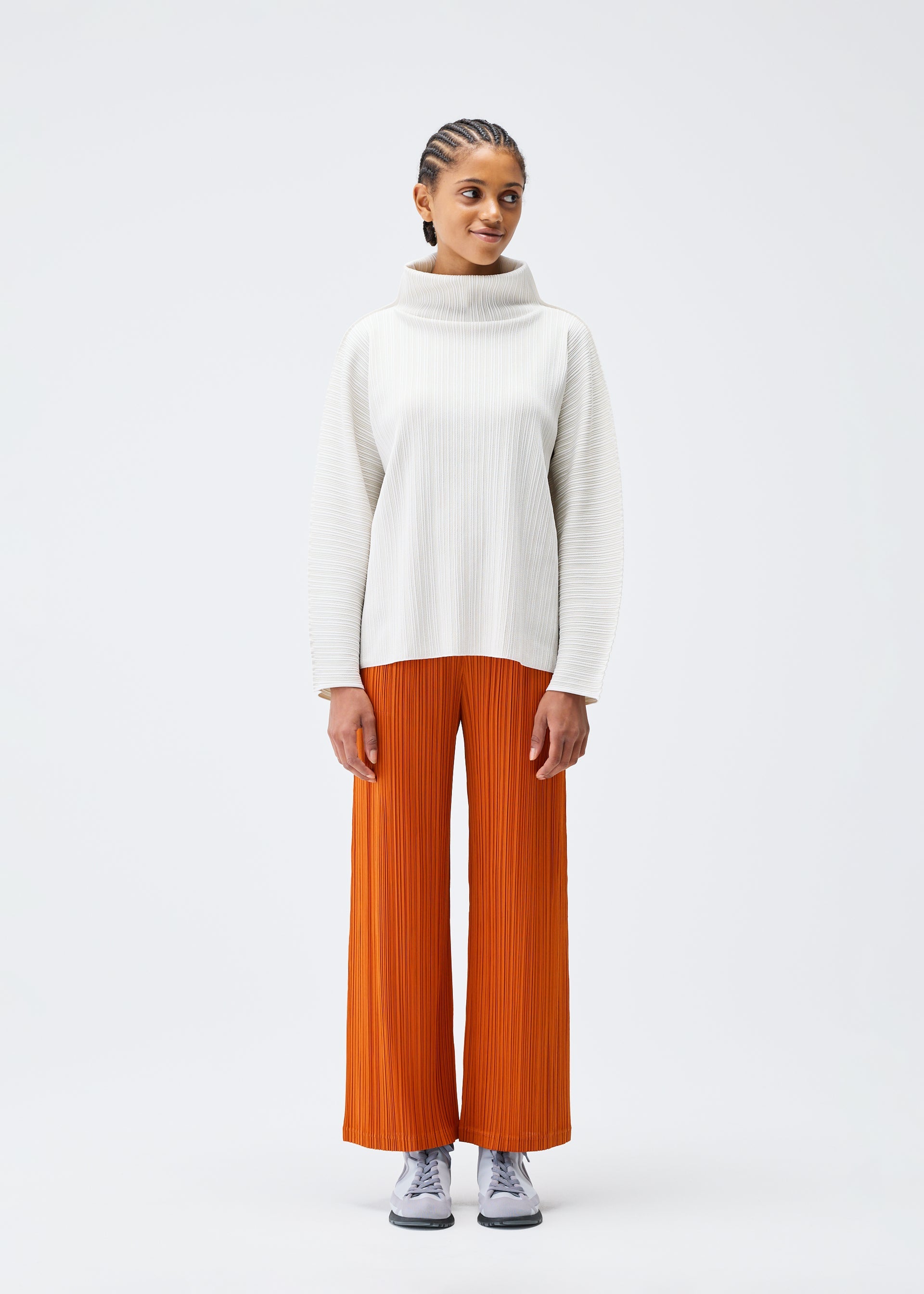 A model wears the PLEATS PLEASE ISSEY MIYAKE A POC SHELL clothing.