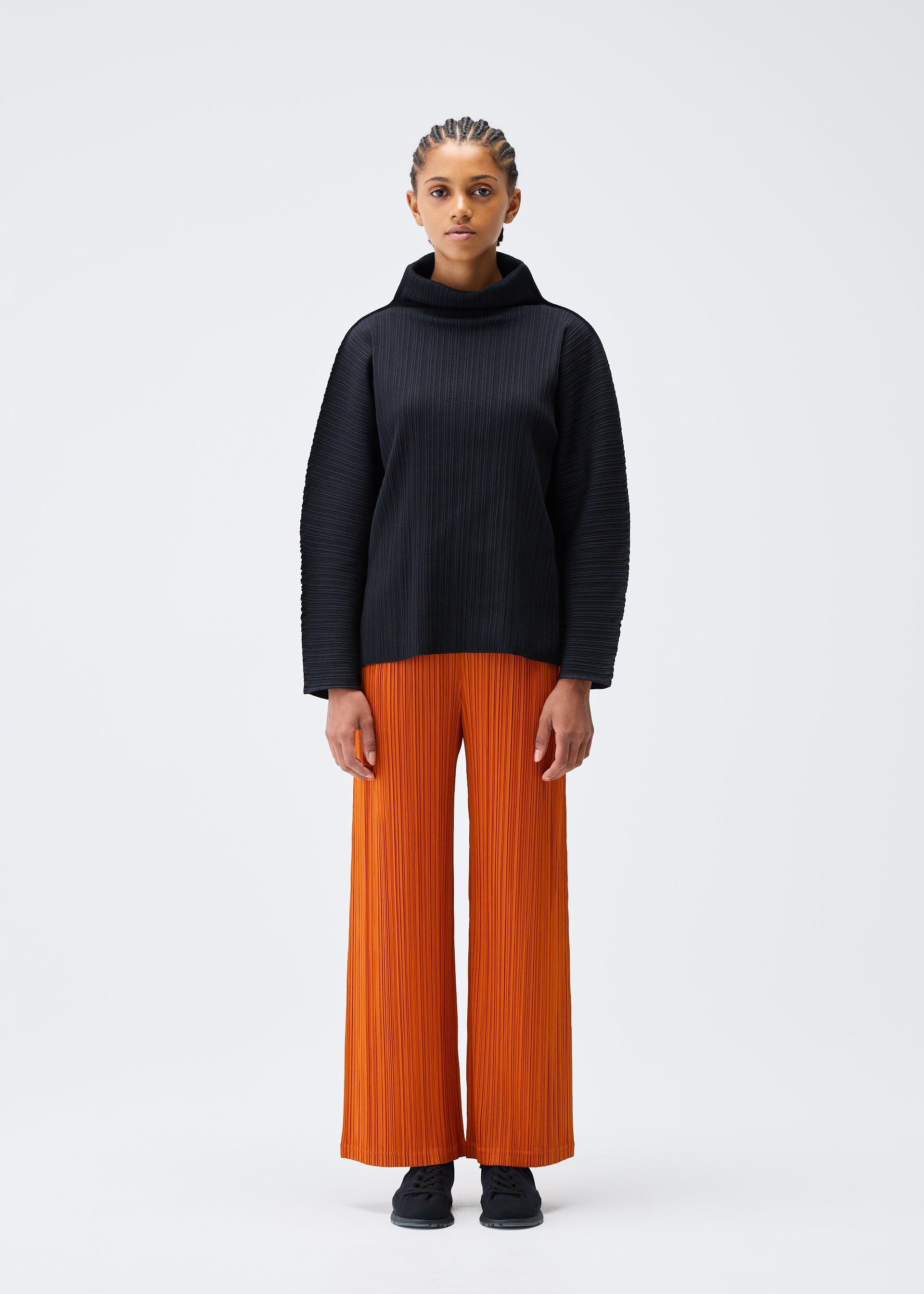 A model wears the PLEATS PLEASE ISSEY MIYAKE A POC SHELL clothing.