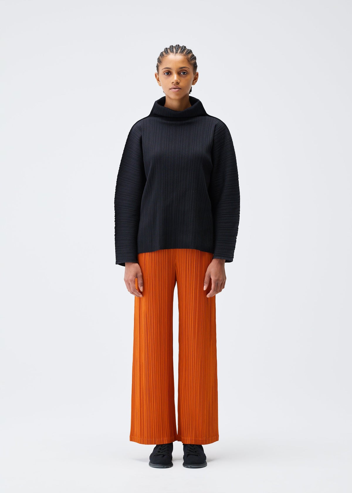 A model wears the PLEATS PLEASE ISSEY MIYAKE A POC SHELL clothing.