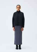 A model wears the PLEATS PLEASE ISSEY MIYAKE CREPE KNIT clothing.