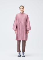 A model wears the PLEATS PLEASE ISSEY MIYAKE SMOOTH COAT coat.