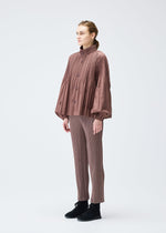 A model wears the PLEATS PLEASE ISSEY MIYAKE SMOOTH COAT jacket.