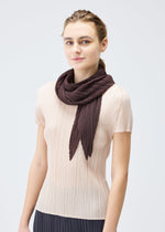 A model wears the PLEATS PLEASE ISSEY MIYAKE MONTHLY SCARF JULY stole.