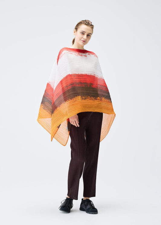 A model wears the PLEATS PLEASE ISSEY MIYAKE JUMP MADAME T stole.