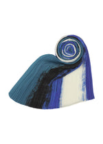 A detail shot of the PLEATS PLEASE ISSEY MIYAKE JUMP MADAME T stole.