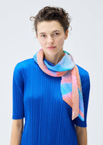 A model wears the PLEATS PLEASE ISSEY MIYAKE GROOVE SCARF stole.