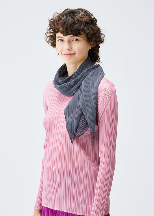 A model wears the PLEATS PLEASE ISSEY MIYAKE MONTHLY SCARF SEPTEMBER stole.