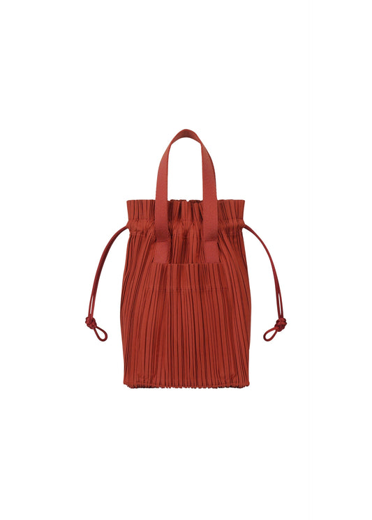 A product shot of the PLEATS PLEASE ISSEY MIYAKE PLEATS TOTE BAG bag in red (24).