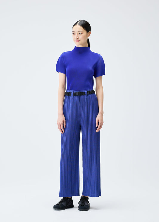 A model wears the PLEATS PLEASE ISSEY MIYAKE PLEATS BELT belt.
