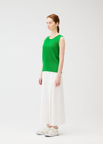 A model wears the PLEATS PLEASE ISSEY MIYAKE MIST APRIL shirt.