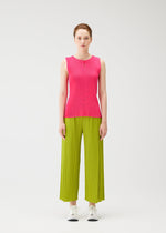 A model wears the PLEATS PLEASE ISSEY MIYAKE MIST JUNE mist-june-shirt-bright-pink.