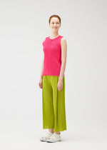 A model wears the PLEATS PLEASE ISSEY MIYAKE MIST JUNE mist-june-shirt-bright-pink.