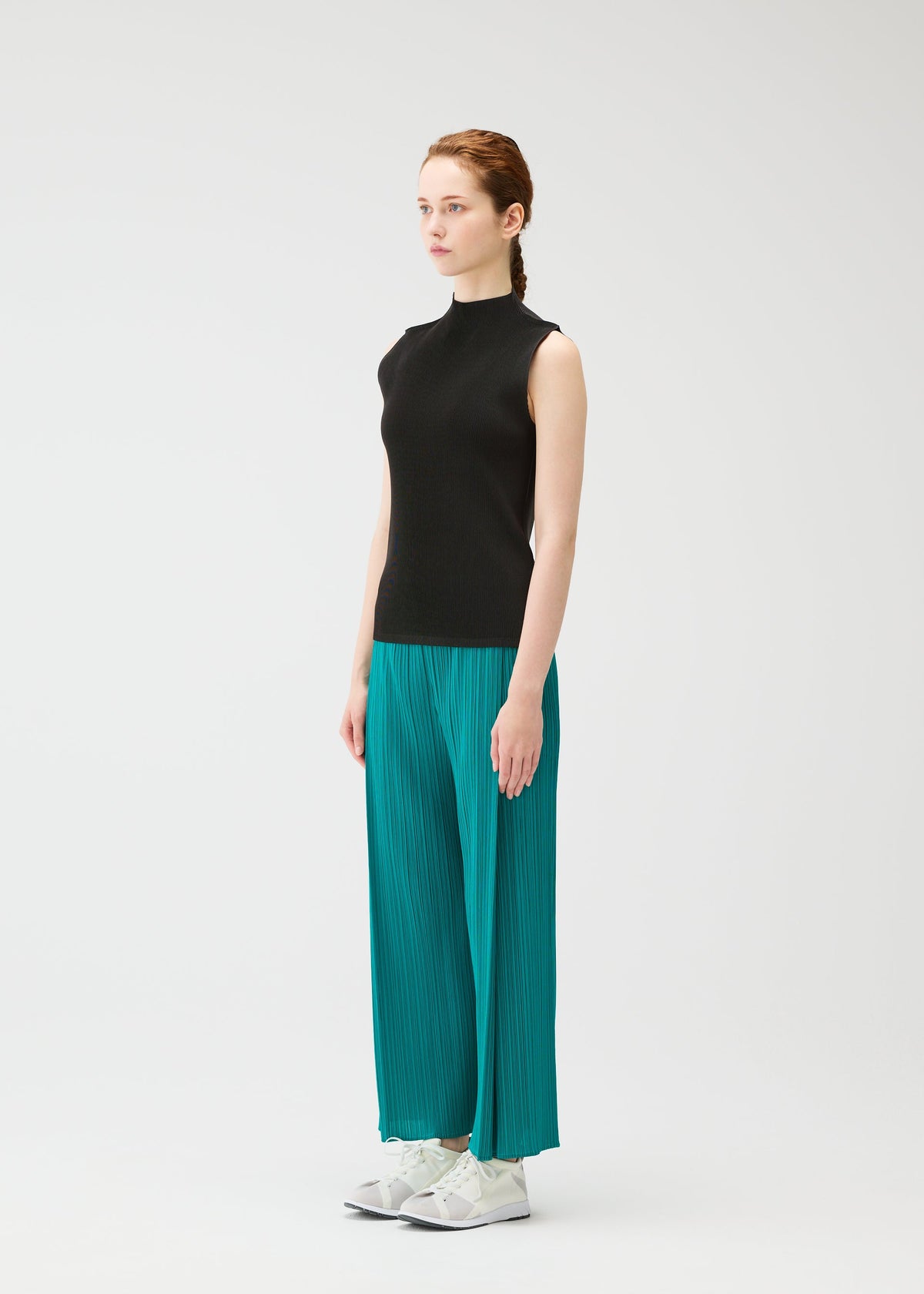 A model wears the PLEATS PLEASE ISSEY MIYAKE MIST JUNE mist-june-shirt-bright-pink-1.