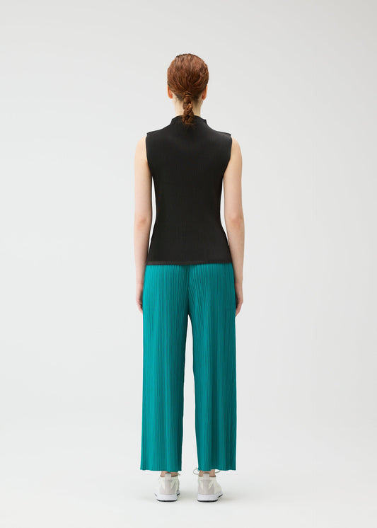 A model wears the PLEATS PLEASE ISSEY MIYAKE MIST JUNE mist-june-shirt-charcoal-1.