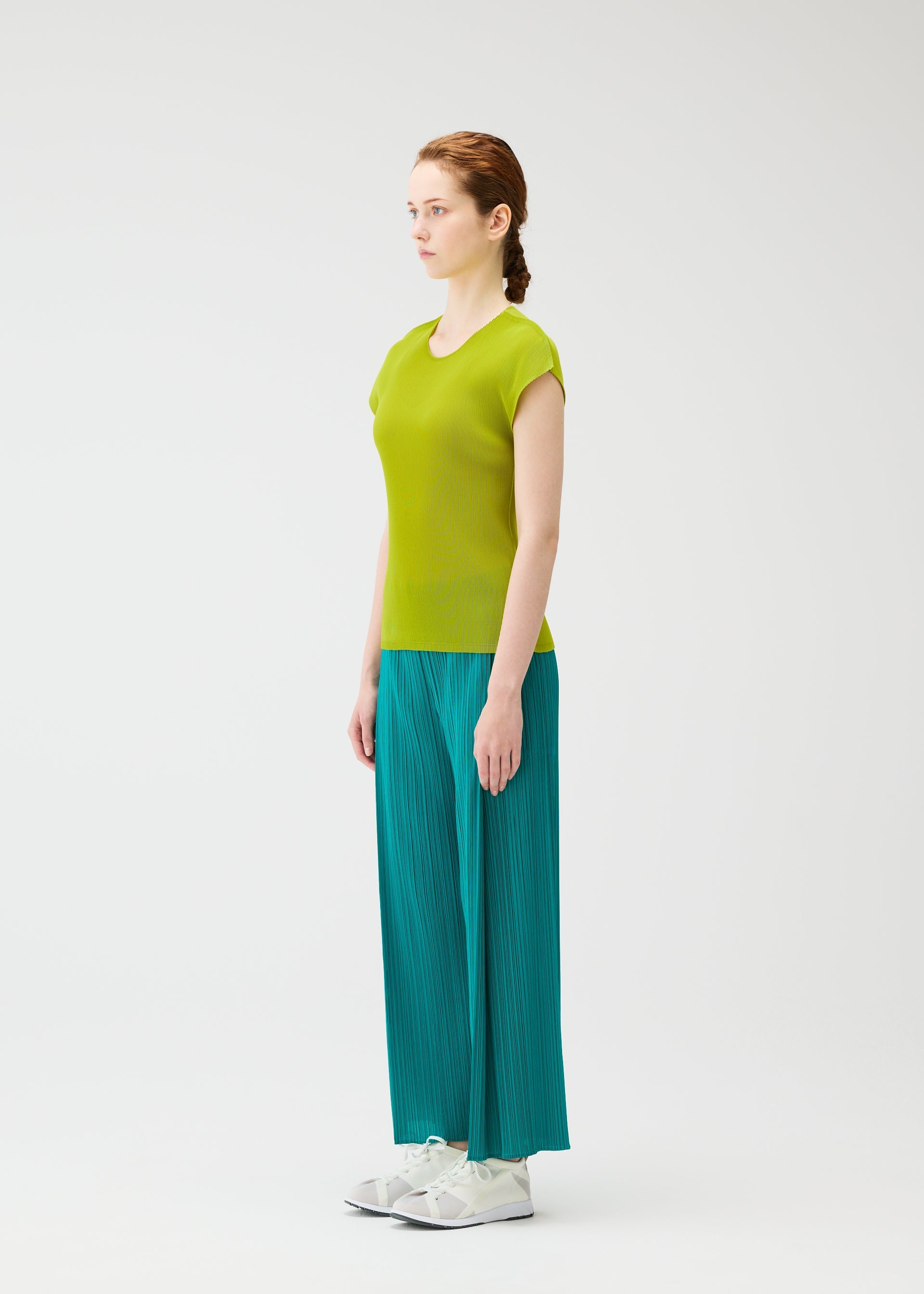 A model wears the PLEATS PLEASE ISSEY MIYAKE MIST JUNE mist-june-shirt-bright-pink-2.