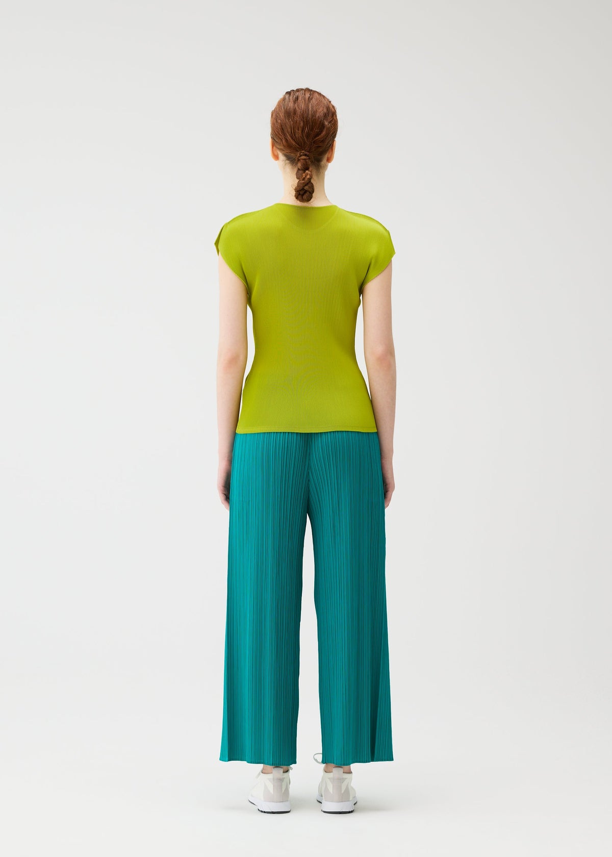 A model wears the PLEATS PLEASE ISSEY MIYAKE MIST JUNE mist-june-shirt-bright-pink-2.