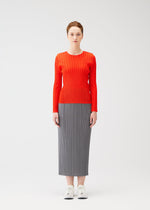 A model wears the PLEATS PLEASE ISSEY MIYAKE RIB PLEATS FEBRUARY shirt.