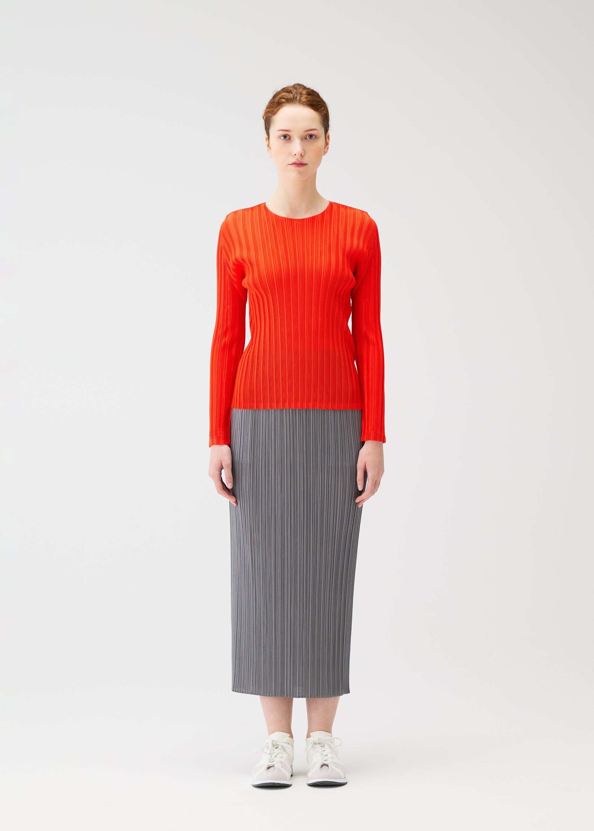 A model wears the PLEATS PLEASE ISSEY MIYAKE RIB PLEATS FEBRUARY shirt.