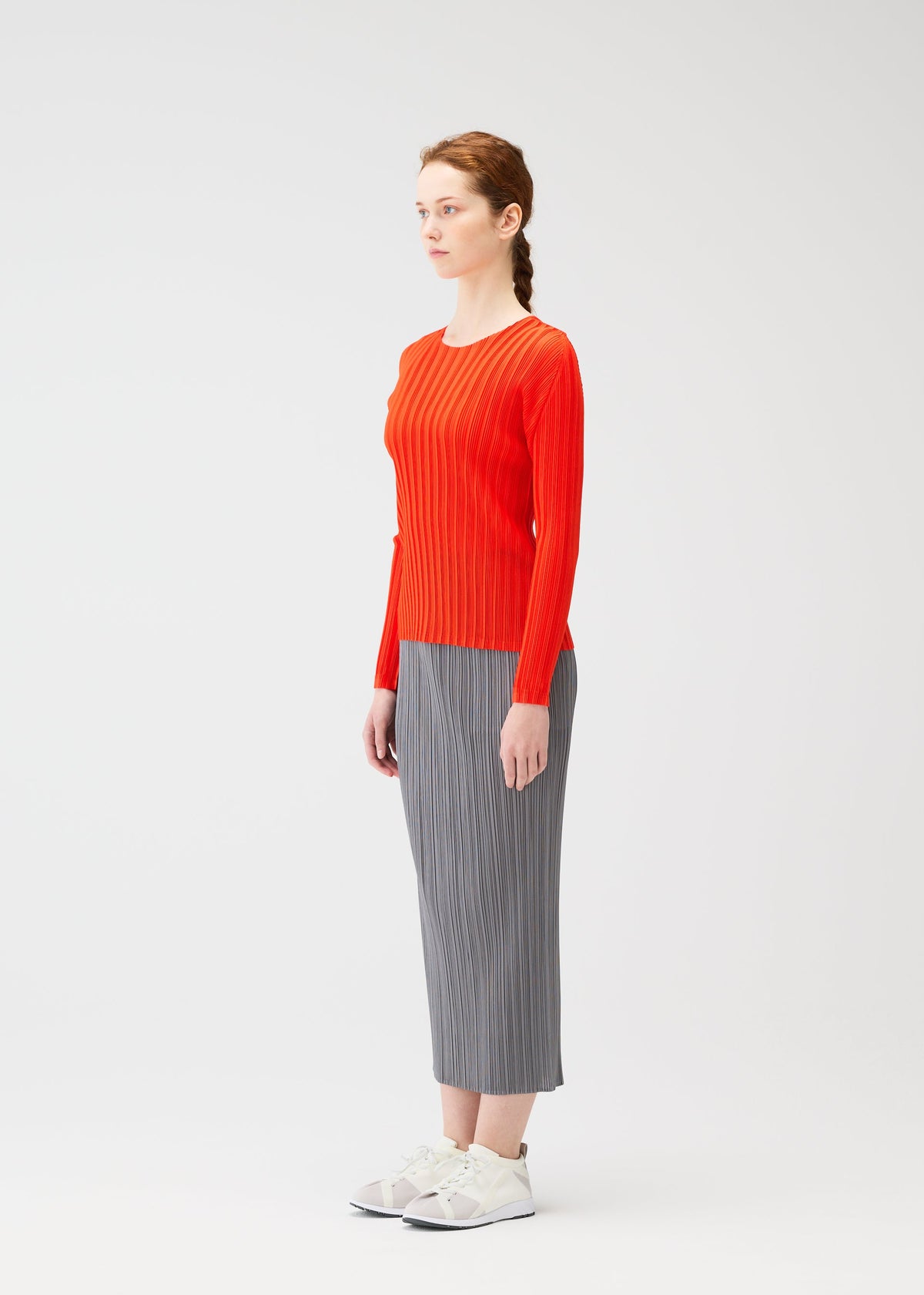 A model wears the PLEATS PLEASE ISSEY MIYAKE RIB PLEATS FEBRUARY shirt.