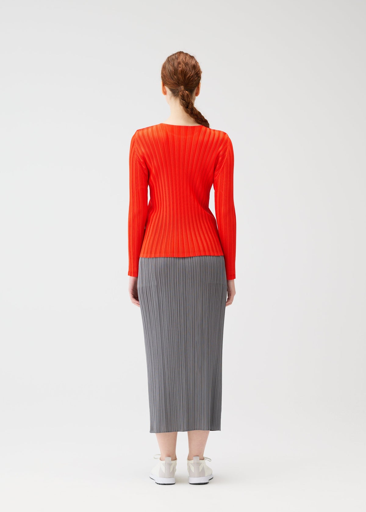 A model wears the PLEATS PLEASE ISSEY MIYAKE RIB PLEATS FEBRUARY shirt.