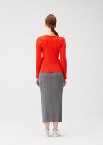 A model wears the PLEATS PLEASE ISSEY MIYAKE RIB PLEATS FEBRUARY shirt.