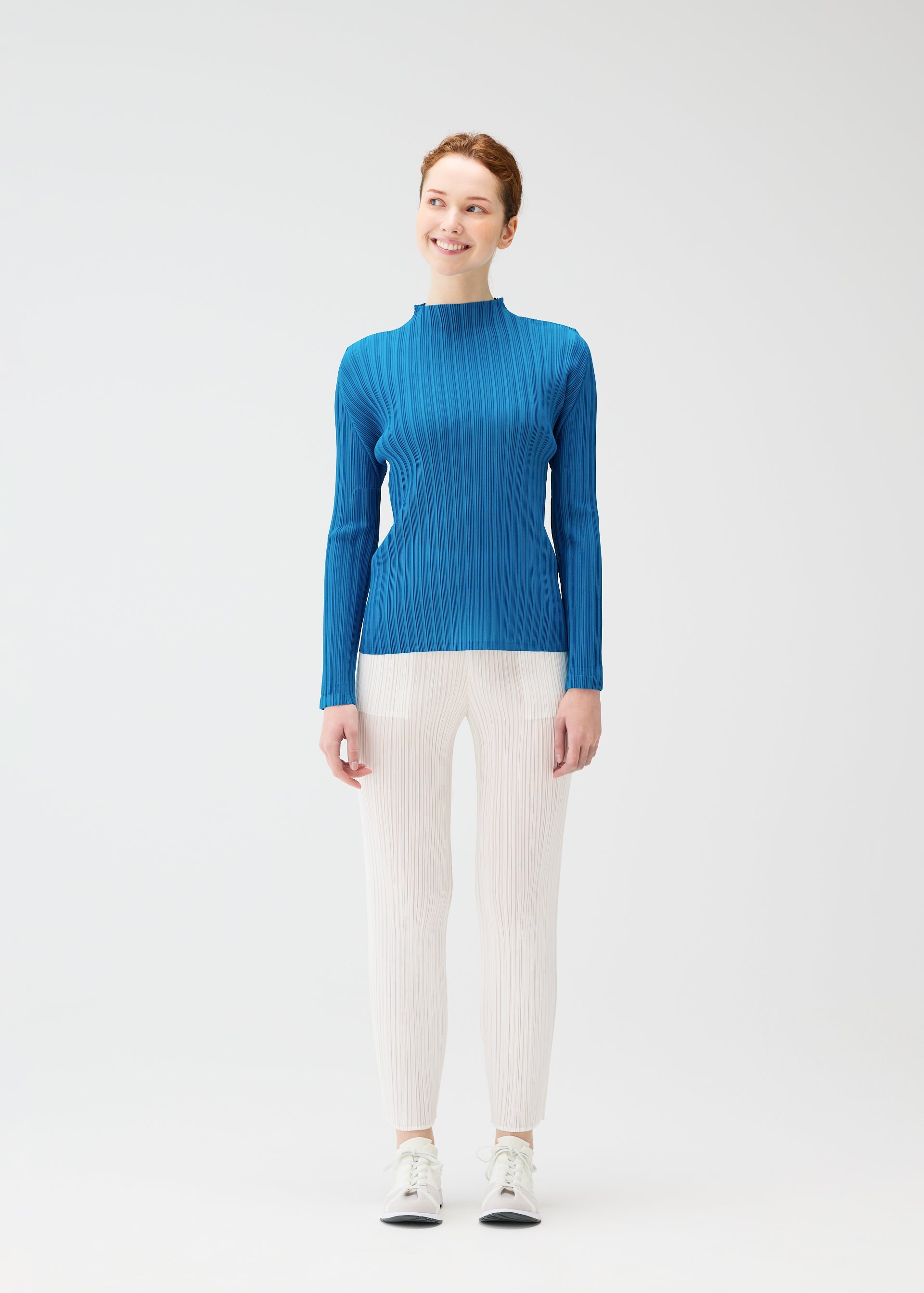 A model wears the PLEATS PLEASE ISSEY MIYAKE RIB PLEATS FEBRUARY shirt.