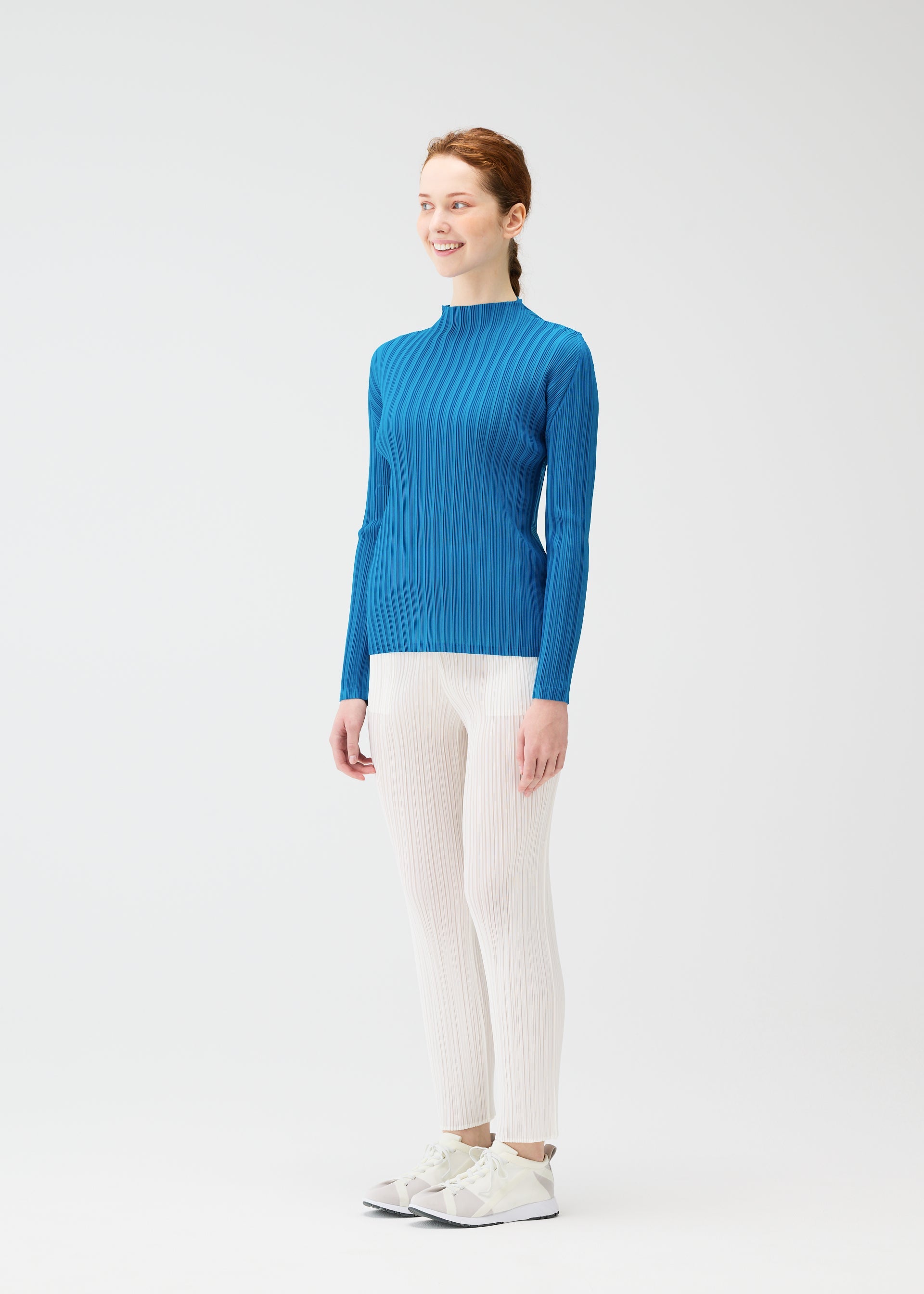 A model wears the PLEATS PLEASE ISSEY MIYAKE RIB PLEATS FEBRUARY shirt.