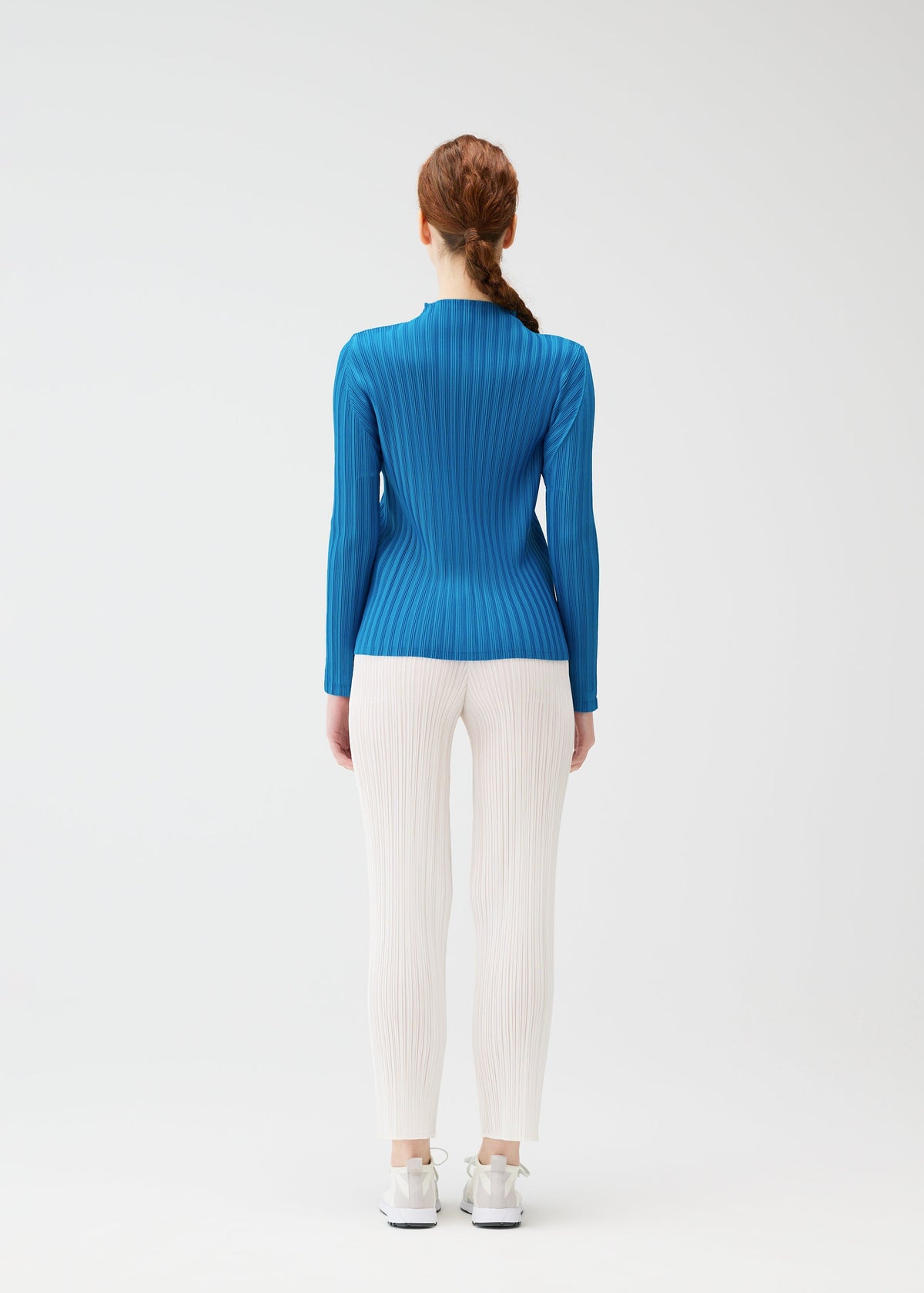 A model wears the PLEATS PLEASE ISSEY MIYAKE RIB PLEATS FEBRUARY shirt.