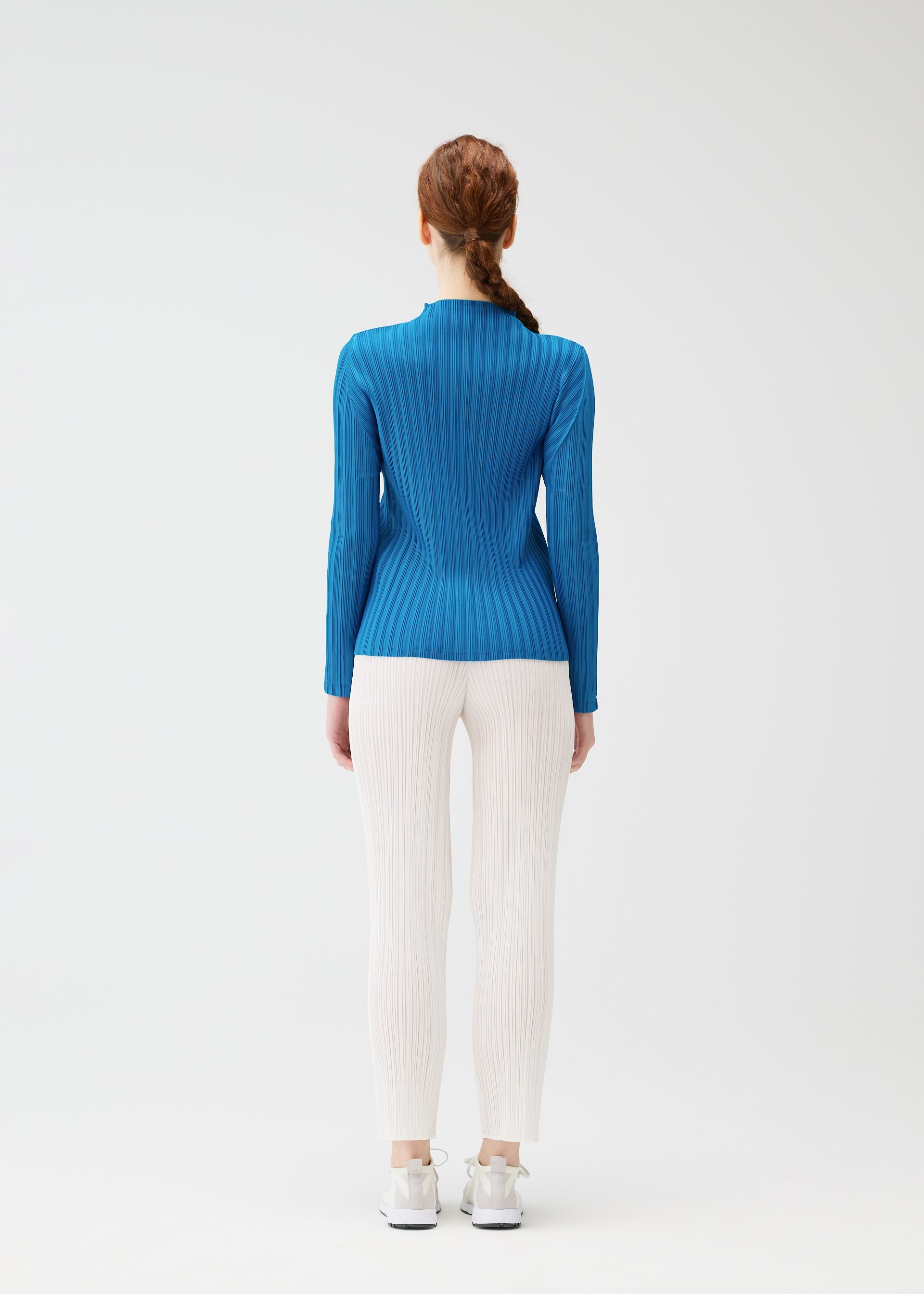 A model wears the PLEATS PLEASE ISSEY MIYAKE RIB PLEATS FEBRUARY shirt.