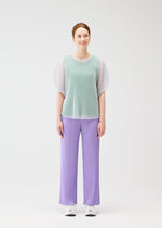 A model wears the PLEATS PLEASE ISSEY MIYAKE TATAMI APRIL shirt.