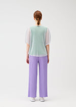 A model wears the PLEATS PLEASE ISSEY MIYAKE TATAMI APRIL shirt.