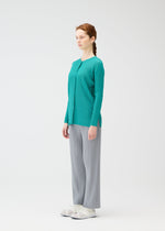 A model wears the PLEATS PLEASE ISSEY MIYAKE RIB PLEATS FEBRUARY cardigan.