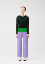 A model wears the PLEATS PLEASE ISSEY MIYAKE TATAMI APRIL cardigan.