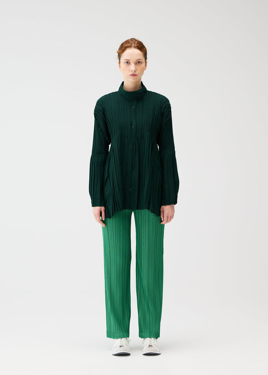 A model wears the PLEATS PLEASE ISSEY MIYAKE FLOAT COAT cardigan.