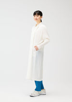 A model wears the PLEATS PLEASE ISSEY MIYAKE MONTHLY COLORS FEBRUARY coat.