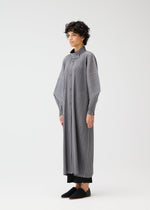 A model wears the PLEATS PLEASE ISSEY MIYAKE SKYLINE clothing.