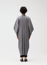 A model wears the PLEATS PLEASE ISSEY MIYAKE SKYLINE clothing.
