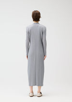 A model wears the PLEATS PLEASE ISSEY MIYAKE FACADE coat.