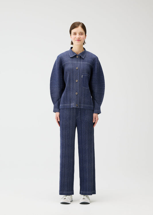 A model wears the PLEATS PLEASE ISSEY MIYAKE COTTON DENIM jacket.