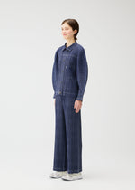 A model wears the PLEATS PLEASE ISSEY MIYAKE COTTON DENIM jacket.