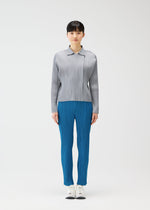 A model wears the PLEATS PLEASE ISSEY MIYAKE MONTHLY COLORS FEBRUARY jacket.