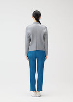 A model wears the PLEATS PLEASE ISSEY MIYAKE MONTHLY COLORS FEBRUARY jacket.