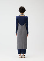 A model wears the PLEATS PLEASE ISSEY MIYAKE MONTHLY COLORS JANUARY clothing.