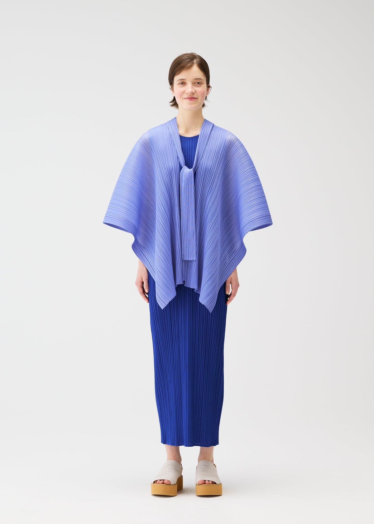 A model wears the PLEATS PLEASE ISSEY MIYAKE LUCID PLEATS vest.
