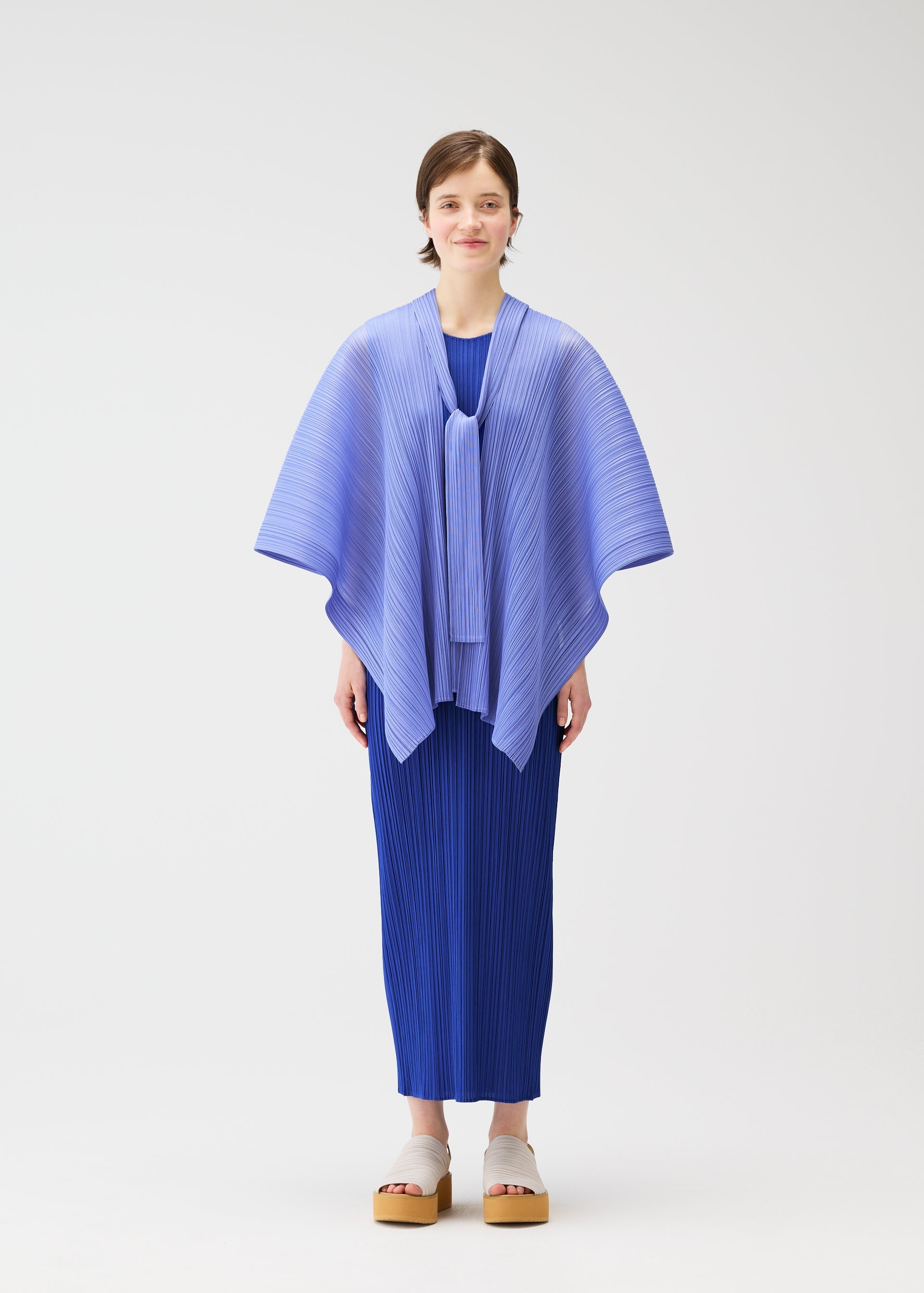 A model wears the PLEATS PLEASE ISSEY MIYAKE LUCID PLEATS vest.