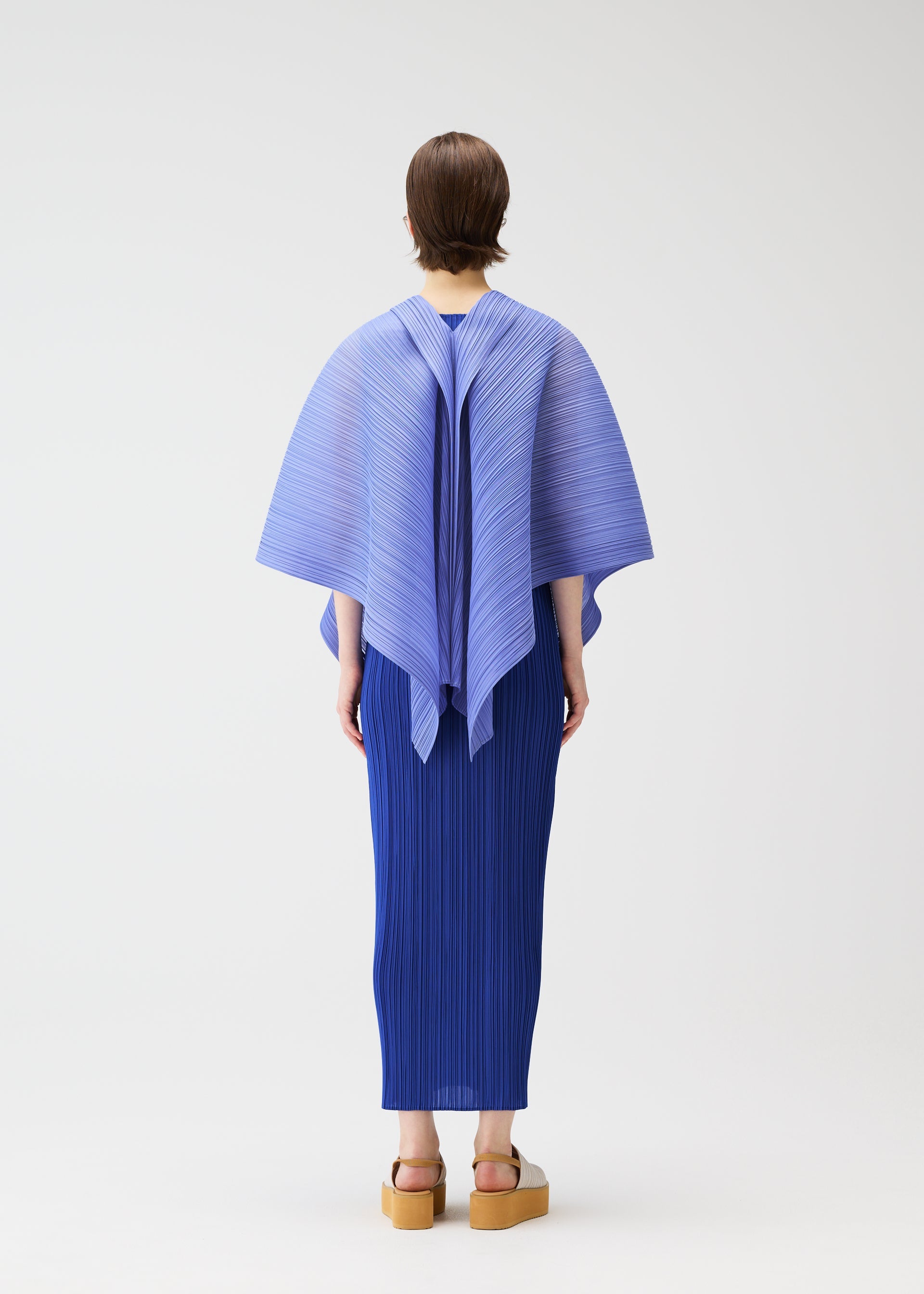 A model wears the PLEATS PLEASE ISSEY MIYAKE LUCID PLEATS vest.